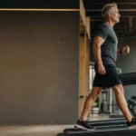 Man over 50 completing a joint-friendly incline cardio walk on a treadmill