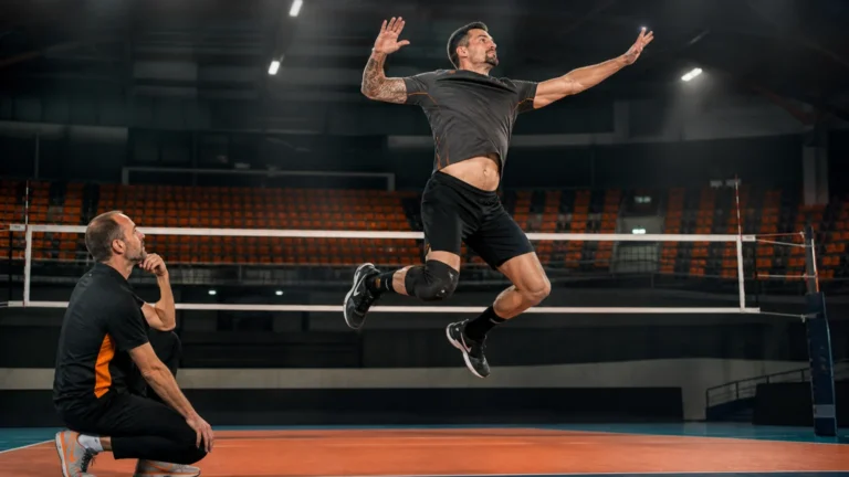 Volleyball-Specific Training | Jump Higher, Move Faster, and Land Better 8 Male volleyball player over 45 completing an explosive approach jump